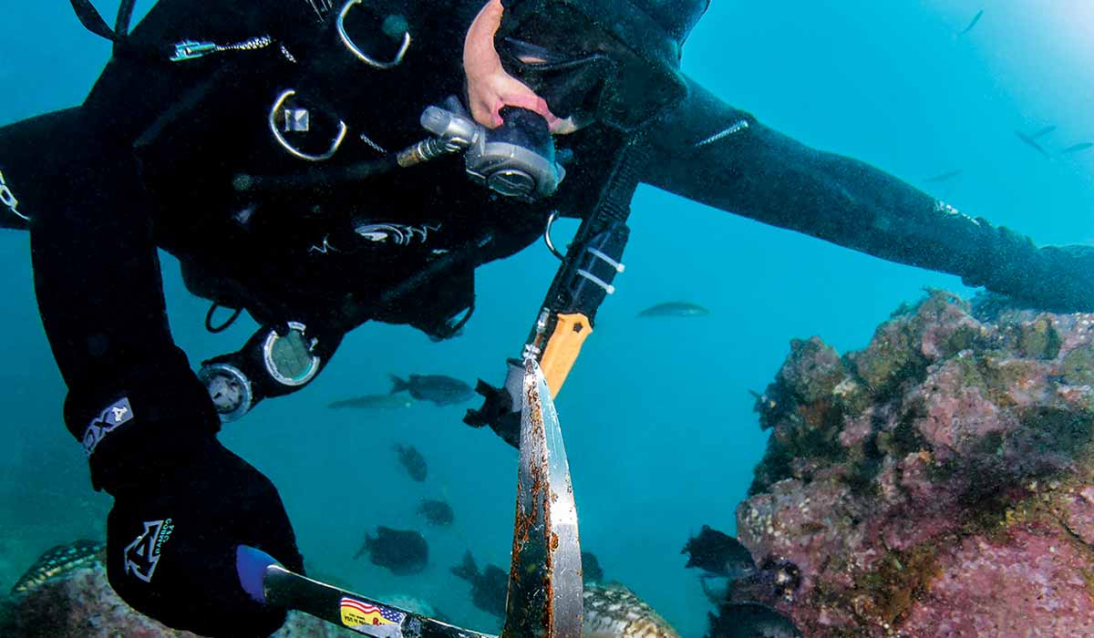 Diver uses a pick axe