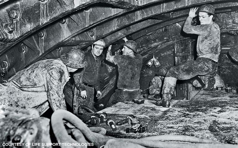 An old photo of workers building tunnels and bridges
