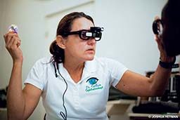 An ophthalmologist performs an eye test in Grenada.