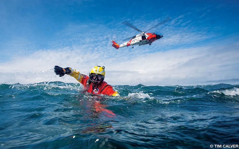 A member of the US Coast Guard swims toward a potential victim