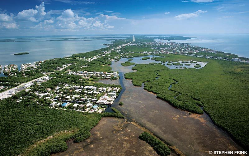 An aerial view reveals the relatively large landmass of Key Largo, the largest of the Florida Keys.