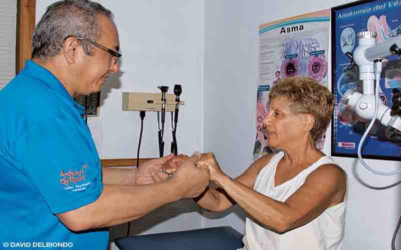 Cookie is on the right and holding her doctor's hands. She received a diagnosis and the right treatment plan.