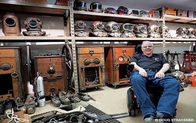 Lee Selisky is at home surrounded by old dive memorabilia.