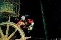 Selisky dives the wreck of the Kamloops in Isle Royale, shown here on the ship’s wheel in more than 200 feet of water.