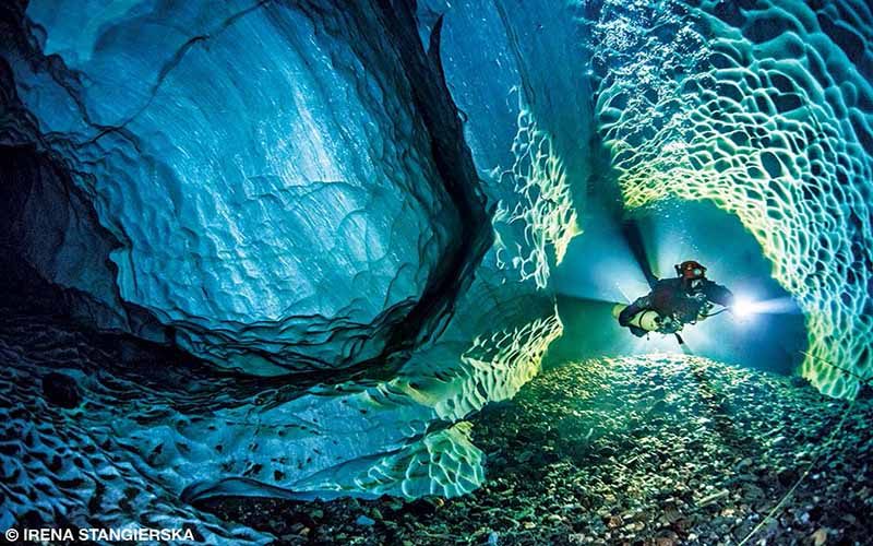A diver hovers amid the white limestone walls of Dolinsjö Cave in northern Sweden.