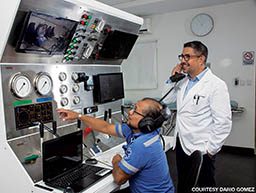 Two doctors oversee a hyperbaric treatment