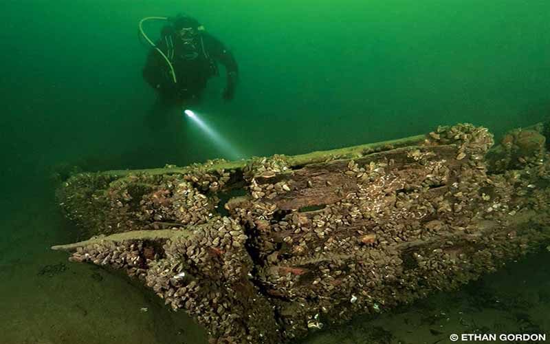 Diver Lars Brinkmann explores the bow of a historic horse ferry wreck near Burlington, Vermont.