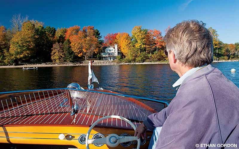 A man steers his boat on the lake