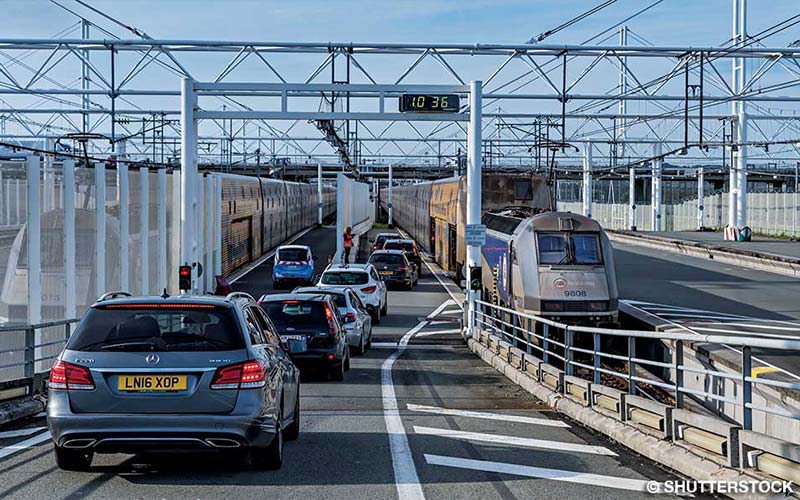 Cars and vans wait to drive through the English Channel Tunnel