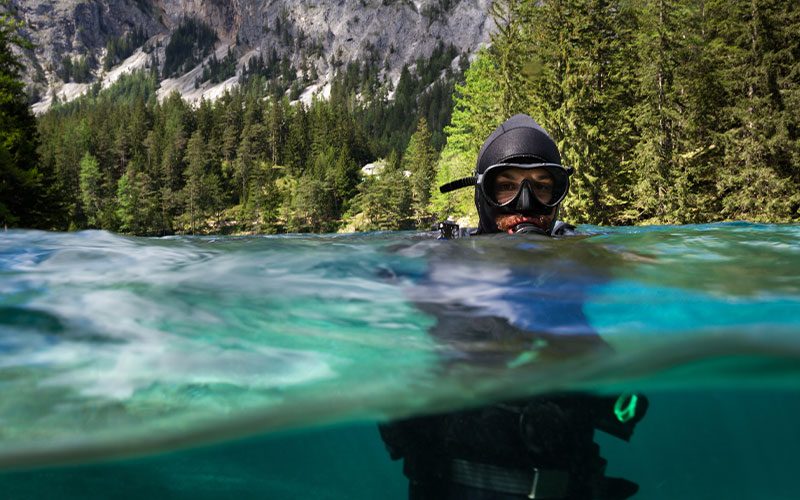 Bearded diver pops his head up out of water