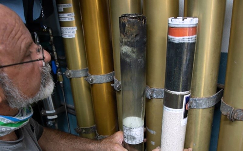 A dive operator is checking the quality of breathing gas cylinders