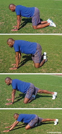 A Black personal trainer starts in cat-cow position and then pigeon pose