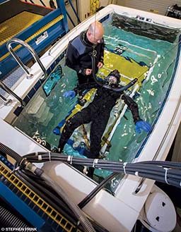 Diver in a tubesuit participates in an experiment