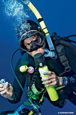 Diver sucks on a spare regulator