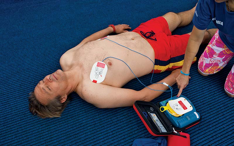 Man lies on ground and receives AED shocks