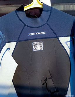 Man's wetsuit with bite marks