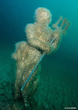 Old sunken statue of Poseidon