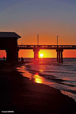 Sunrise over the Gulf Coast with pier in background