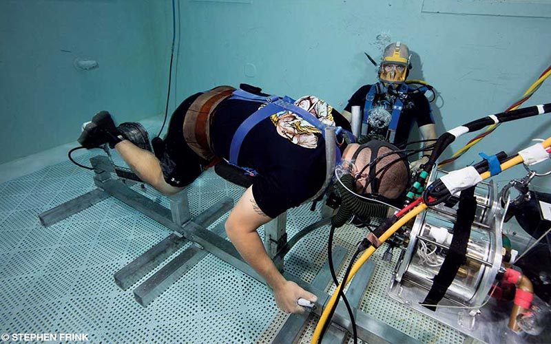 Two Navy divers performing tests