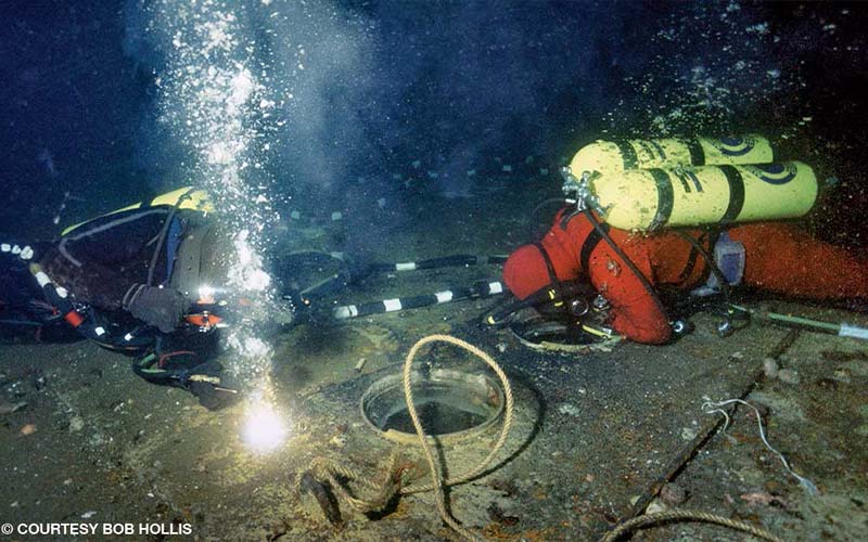 Two divers explore the SS Andrea Doria
