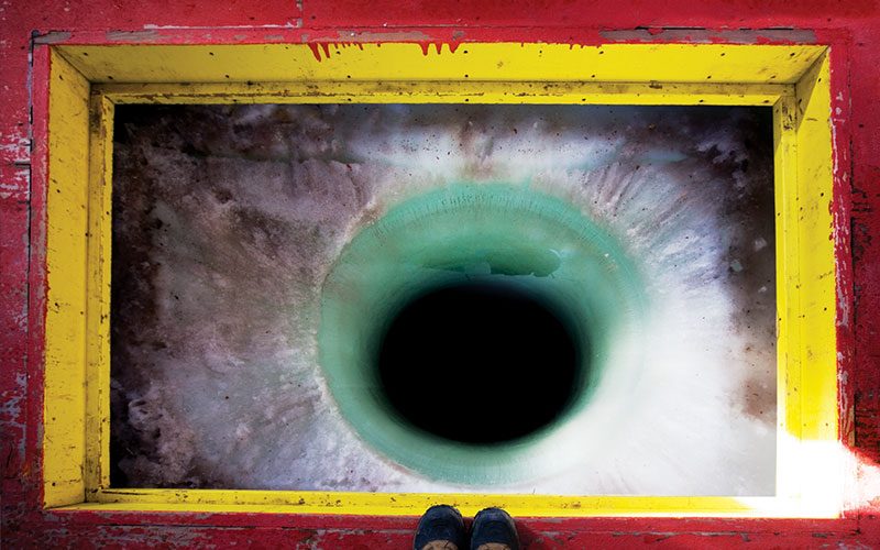 A red frame around a deep hole in the ice