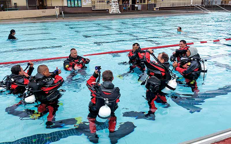 Advanced divers take a class in a pool