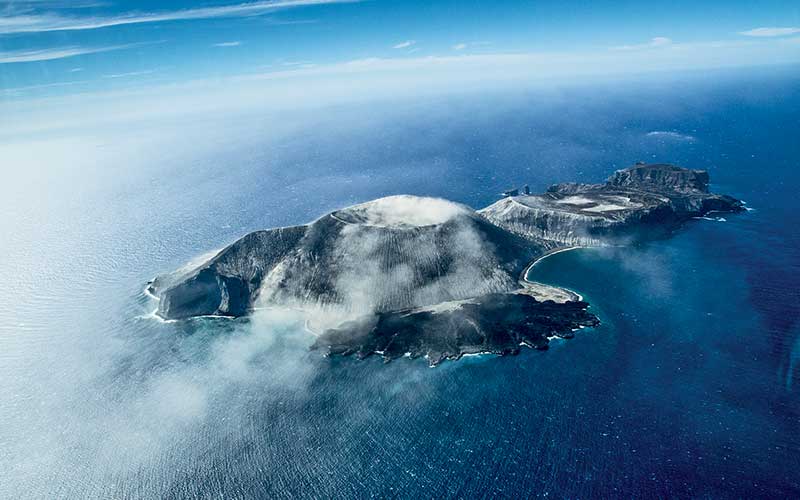Aerial view of a foggy island