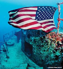 American flag waves on a sunken ship
