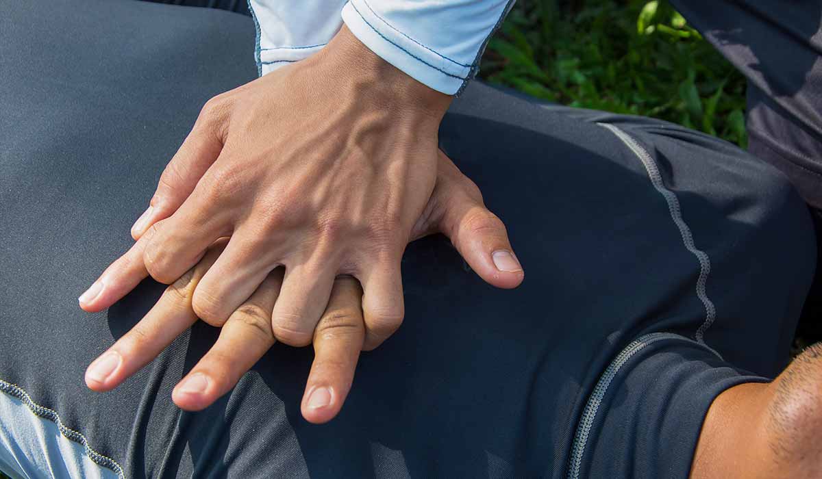 Close up of hands performing CPR