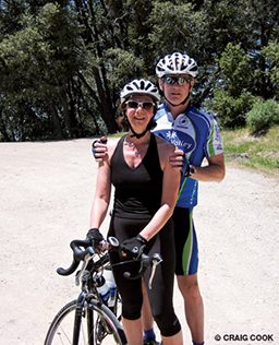 Cycling couple pose for a quick photo