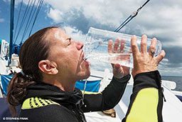 Diver chugs a giant beaker of water