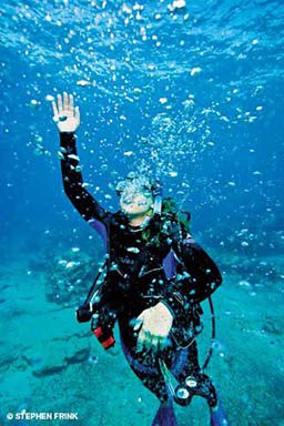 Diver is struggling to surface and surrounded by bubbles