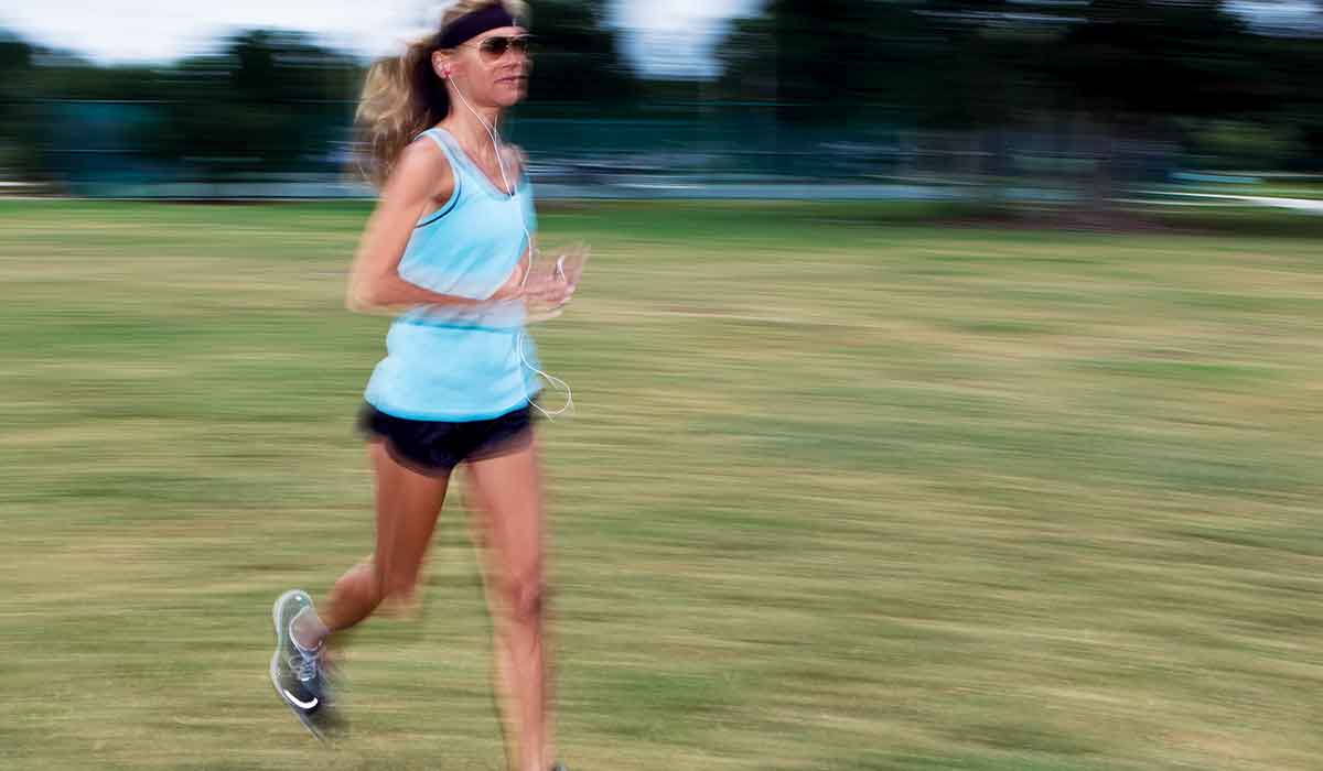 Female running so fast she blurs the image