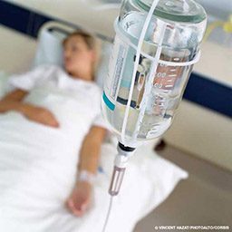 IV drip for a woman in a hospital bed