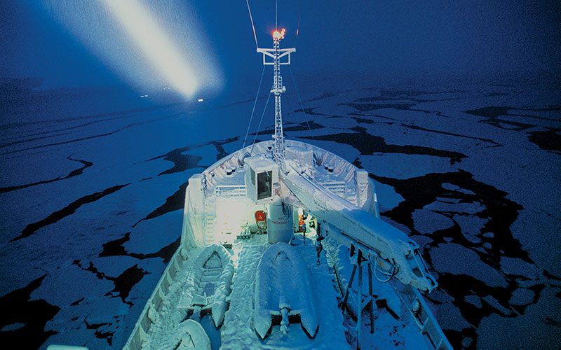 The icy exterior of a ship at night
