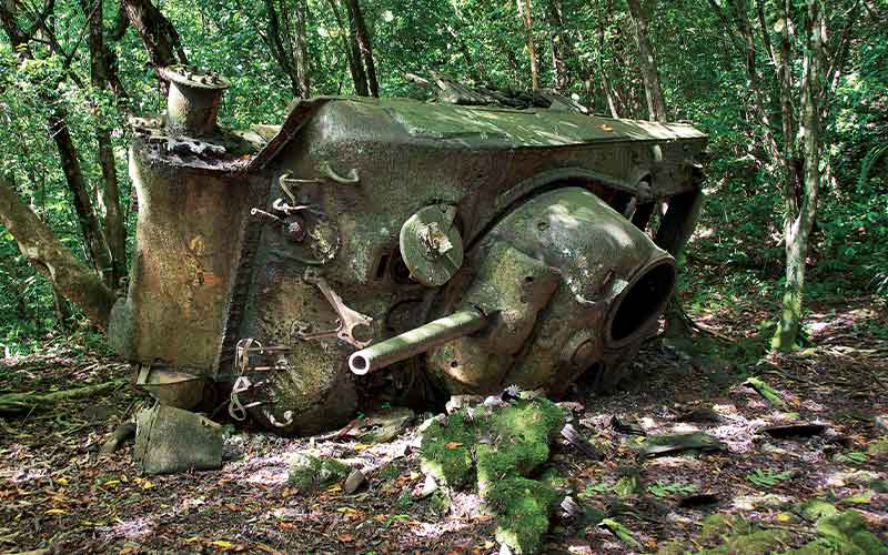 Toppled over US tank stranded in a jungle