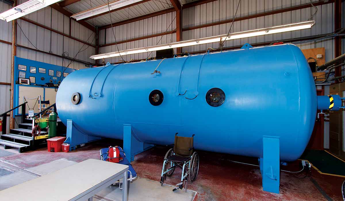 Very blue hyperbaric chamber is in a shack