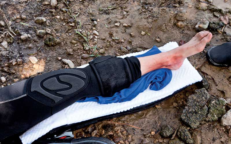 An injured left leg rests on a homemade cushion and is ready for a splint