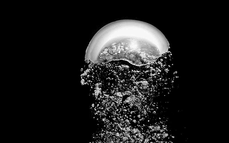 Black-and-white image of an exhalation bubble with thousands of little bubbles