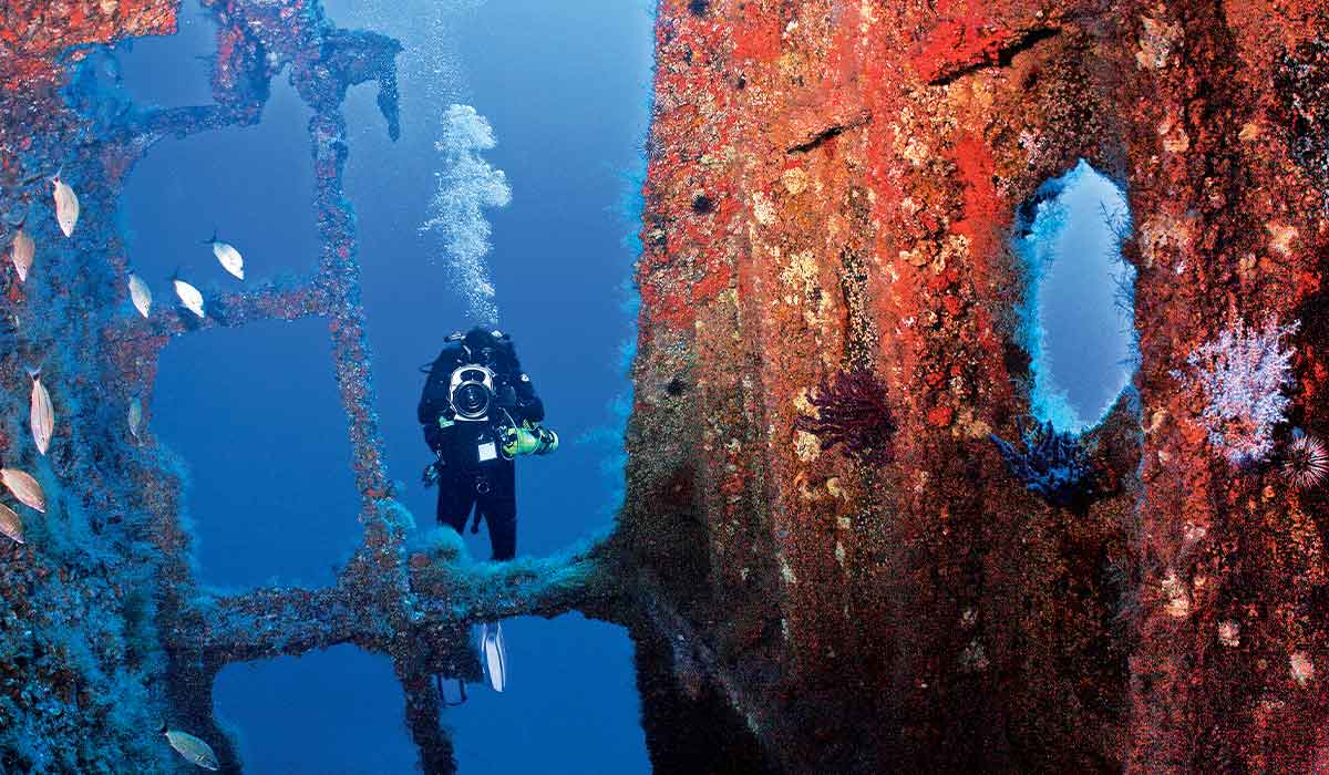 Dive photographer shoots image of shipwreck
