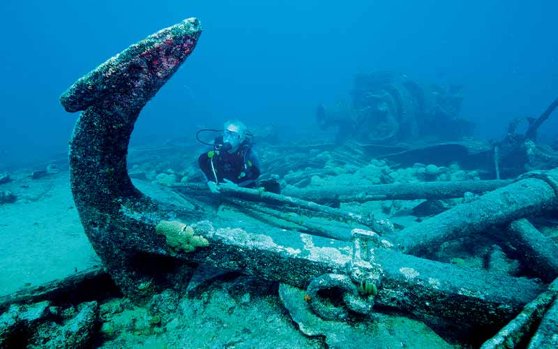Diver behind a sunken anchor