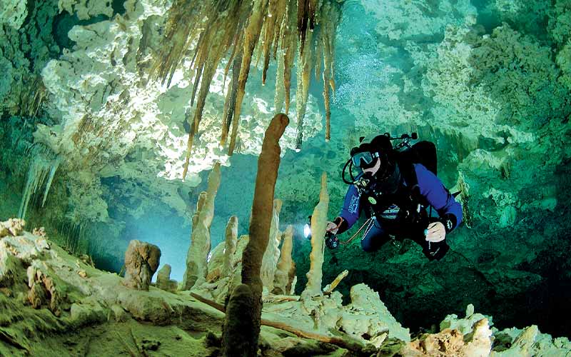 Diver explores an underwater cave