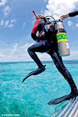 Diver wearing nitrox tank jumps off boat