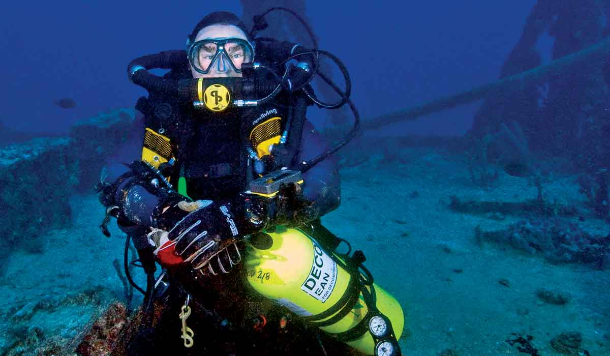Rebreather diver pauses at a shipwreck