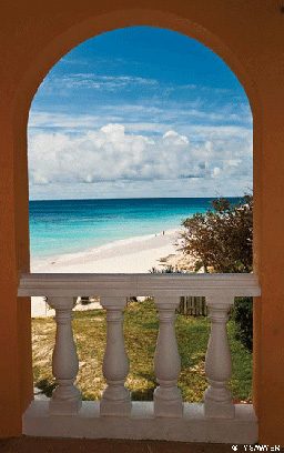 Window view of the beach and blue skies