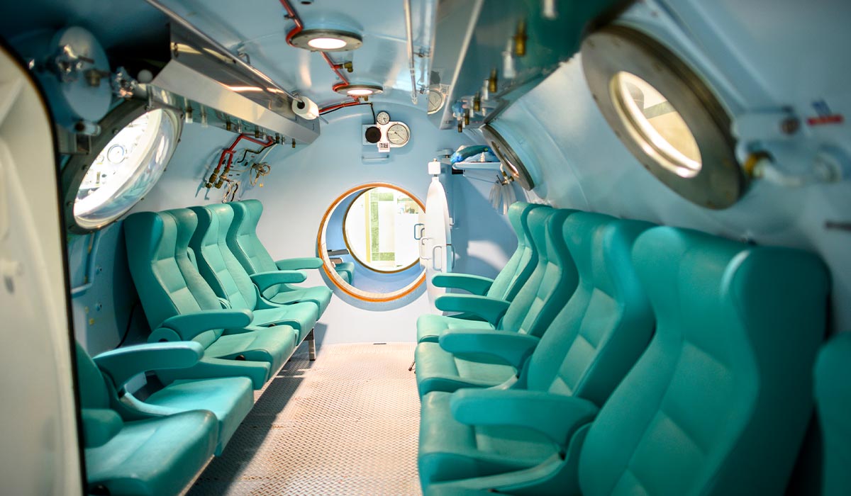 Hyperbaric chamber with green seats is waiting for the next patient