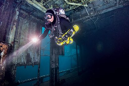 Diver in the hangar bay on the USS Oriskany