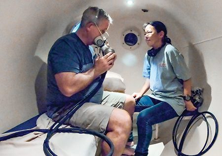 Keiko, the hyberbaric chamber technician, stayed with McNab in the chamber.