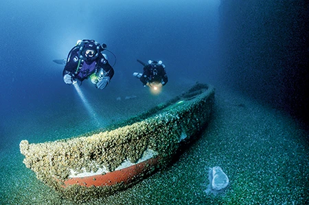 Lifeboat rests on the lake bottom.