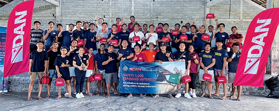 Dive industry workers gather after completing the DAN first aid training